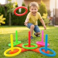 Boy playing outdoors with the vibrant and colorful interactive Circle Throwing Puzzle & Ring Toss Game.